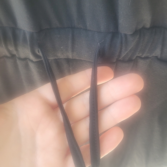 Sophisticated Black Wrap-Style Jumpsuit with Tapered Legs - Picture 5 of 14